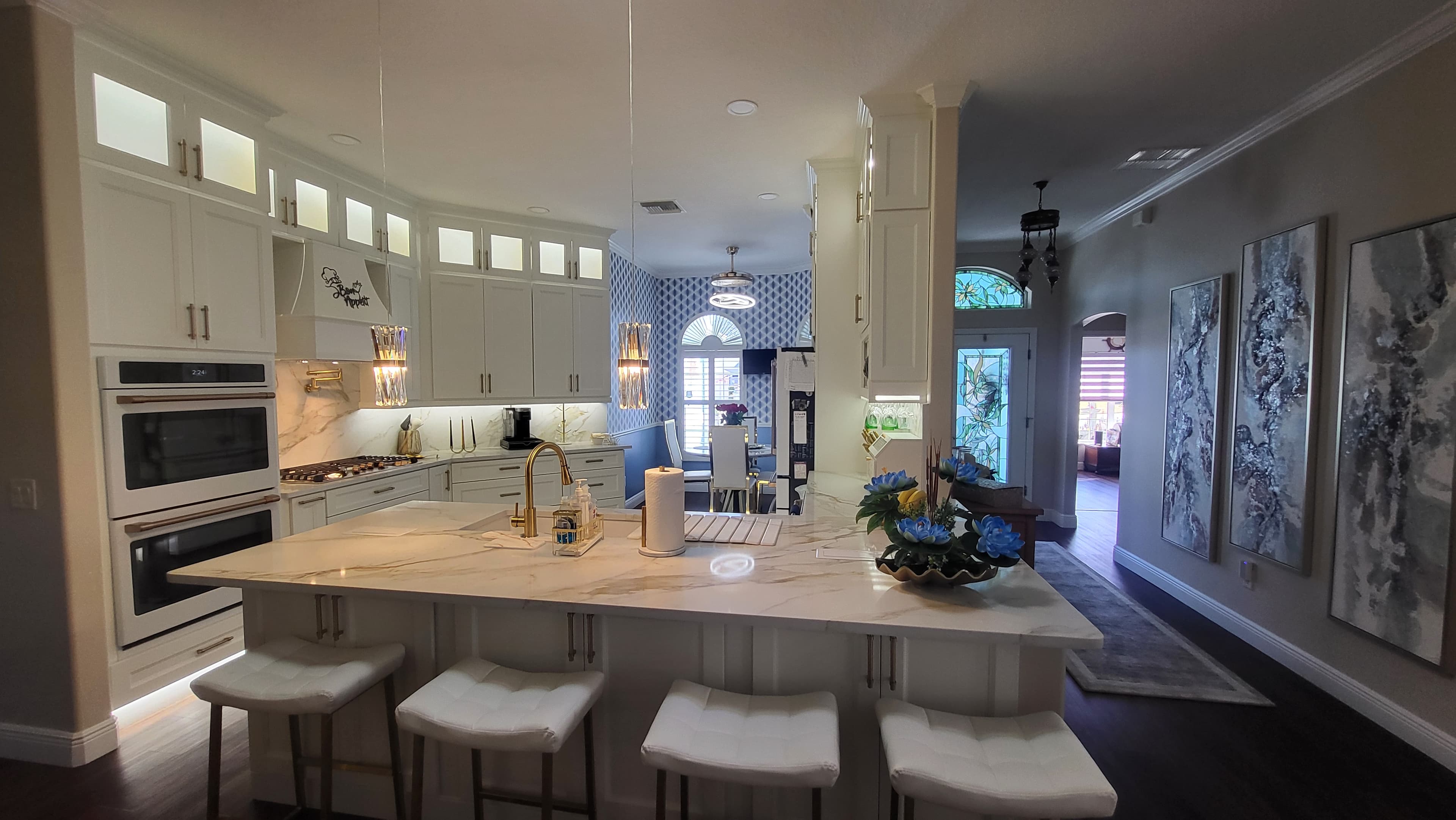 Glide-Lock kitchen - White tower cabinets with blue wallpaper accent