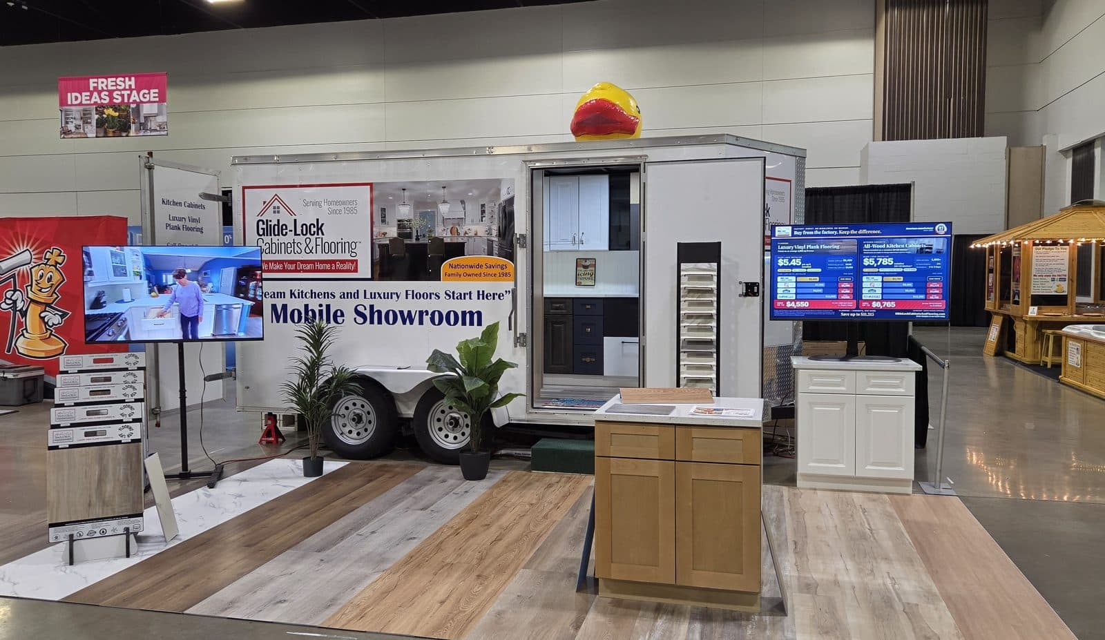 Glide-Lock Mobile Showroom set up at a home show with cabinet and flooring displays